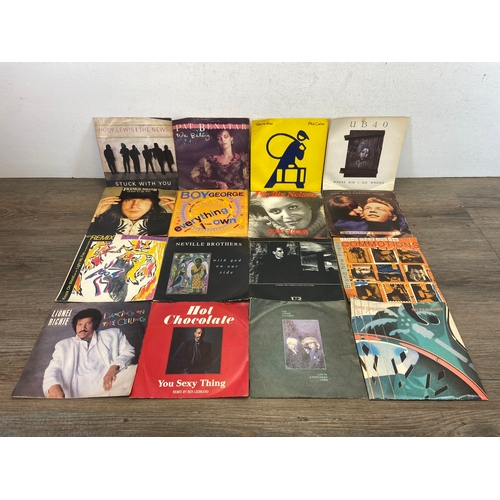 748 - A collection of vinyl records and CDs by a variety of artists and bands to include The Cure, U2, Dir... 