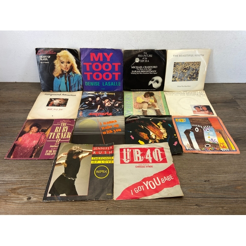 748 - A collection of vinyl records and CDs by a variety of artists and bands to include The Cure, U2, Dir... 