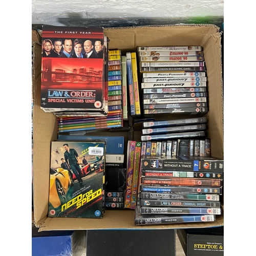 748A - Three boxes of DVDs contains a wide variety of movies and TV shows to include Friends complete serie... 