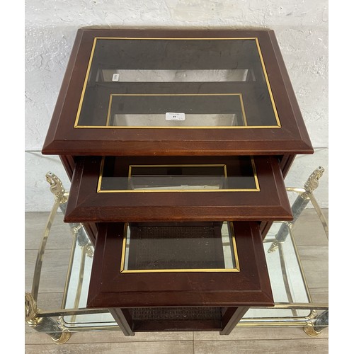 89 - Two pieces of furniture, one mahogany and smoked glass nest of tables and one gilt metal and marble ... 