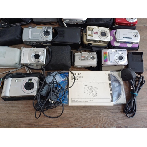 676 - A collection of compact digital cameras to include Toshiba PDR-5 with accessories, Kodak EasyShare M... 