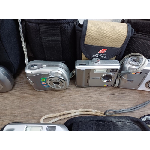 676 - A collection of compact digital cameras to include Toshiba PDR-5 with accessories, Kodak EasyShare M... 