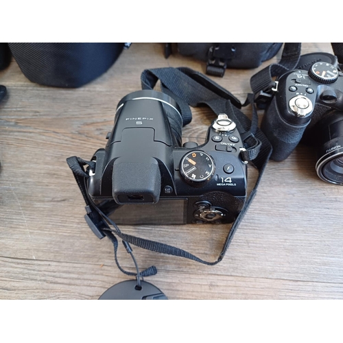 678 - Four Fujifilm FinePix 14mp digital bridge cameras, one SL245, one S2950 and two S4300