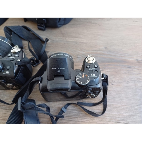 678 - Four Fujifilm FinePix 14mp digital bridge cameras, one SL245, one S2950 and two S4300