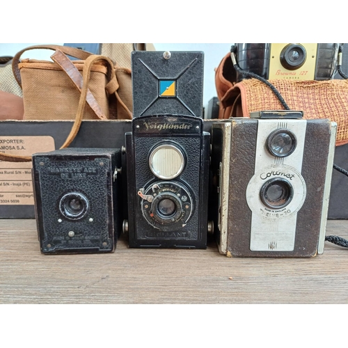 682 - A collection of box cameras and pseudo TLRs to include Voigtländer Brilliant, Kodak 'Hawkeye' Ace De... 