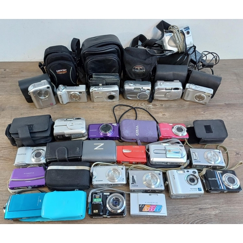 692 - A collection of Fujifilm FinePix compact digital cameras to include T350 14mp, AX350 16mp, AX280 14m... 