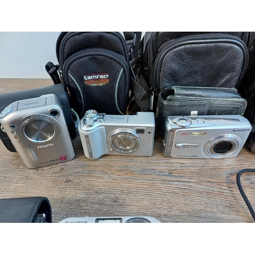 692 - A collection of Fujifilm FinePix compact digital cameras to include T350 14mp, AX350 16mp, AX280 14m... 