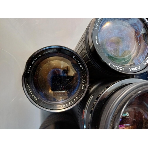 703 - A collection of lenses to include Carl Zeiss, Olympus, Sigma, Hanimex, Soligor etc.