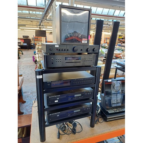 729 - A four-tier hi-fi stand with spikes containing six items of hi-fi, two Cambridge Audio CD4 Special E... 