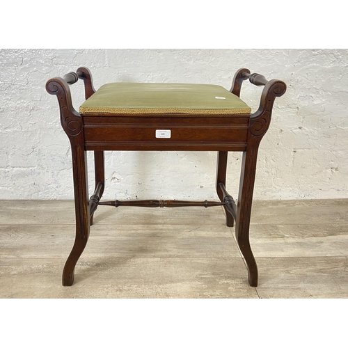 140 - An Edwardian mahogany and green fabric upholstered twin handled piano stool - approx. 60cm high x 58... 