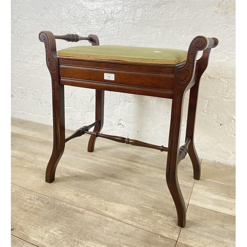 140 - An Edwardian mahogany and green fabric upholstered twin handled piano stool - approx. 60cm high x 58... 