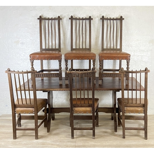 215A - A Nigel Griffiths carved oak dining table and six leather chairs - table approx. 72cm high x 74cm wi... 