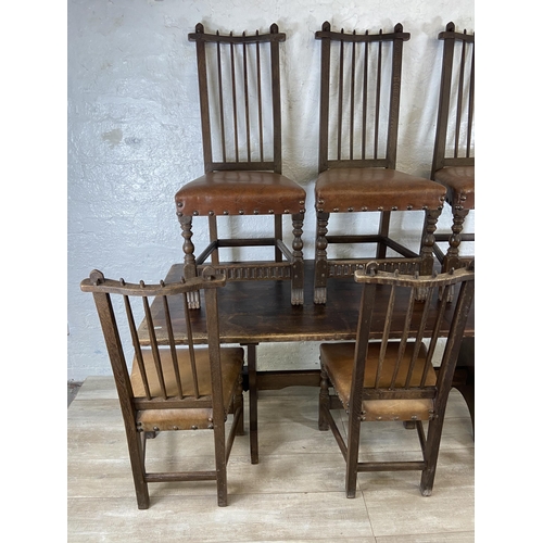 215A - A Nigel Griffiths carved oak dining table and six leather chairs - table approx. 72cm high x 74cm wi... 