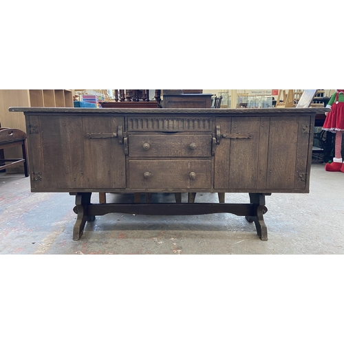 215B - A Nigel Griffiths carved oak sideboard - approx. 76cm high x 168cm wide x 46cm deep