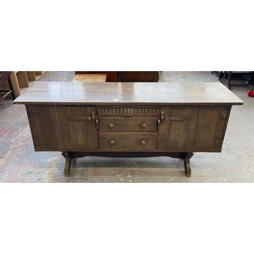 215B - A Nigel Griffiths carved oak sideboard - approx. 76cm high x 168cm wide x 46cm deep