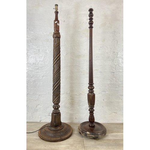 233A - Two standard lamps, one mahogany and one carved beech - largest approx. 156cm high