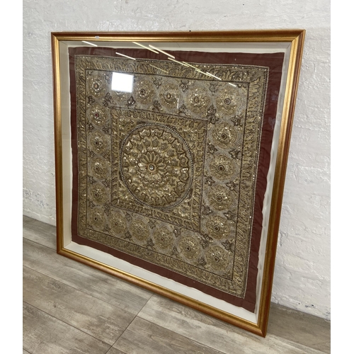 275A - A mid/late 20th century gilt framed Indian sequin and silk embroidered wall hanging - approx. 130cm ... 