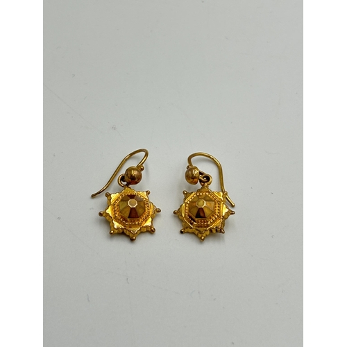 2180 - A pair of late 19th/early 20th century 9ct gold hook earrings - approx. gross weight 0.97g