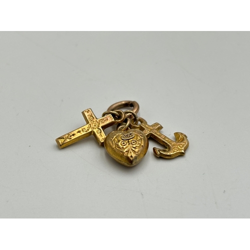 2179 - Three 9ct gold charms - approx. gross weight 1.1g