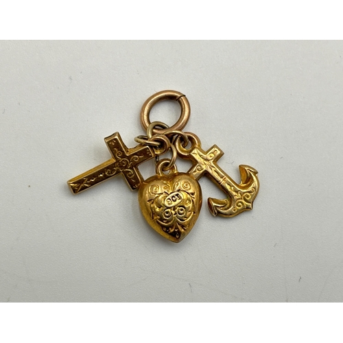 2179 - Three 9ct gold charms - approx. gross weight 1.1g