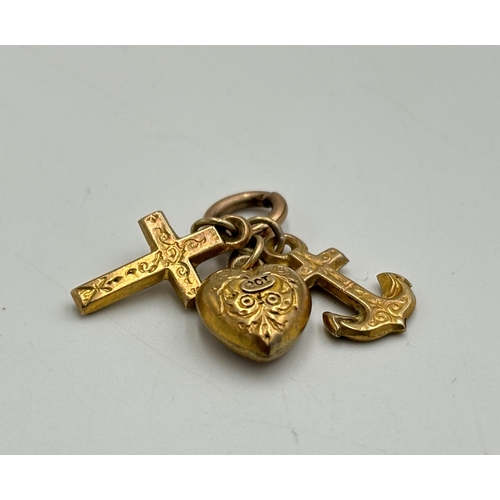 2179 - Three 9ct gold charms - approx. gross weight 1.1g