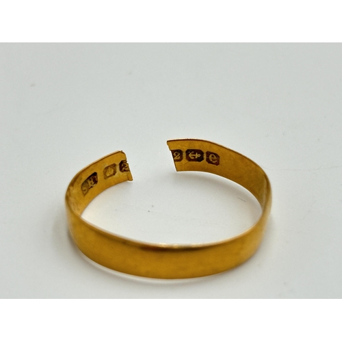 2183 - A hallmarked Birmingham 22ct gold wedding band - approx. gross weight 2.6g