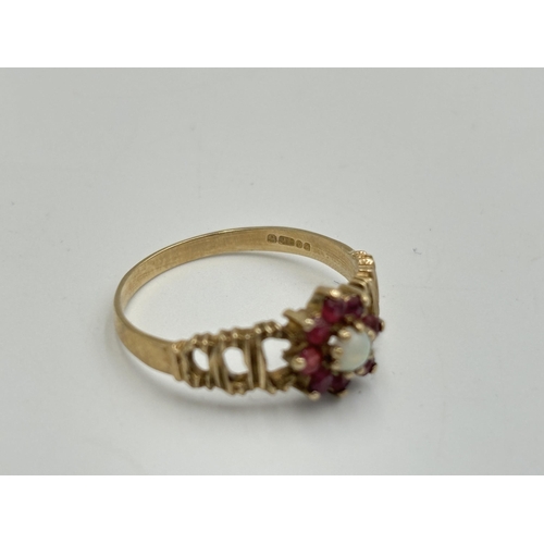 2189 - A hallmarked London 9ct gold ruby and opal ring with textured shoulders, size O - approx. gross weig... 