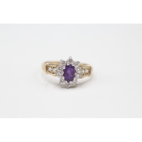 2111 - A 9ct gold amethyst and cubic zurconia halo ring - approx. gross weight 2.1g