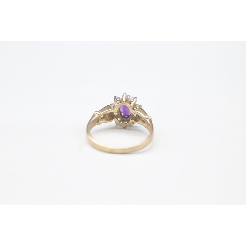 2111 - A 9ct gold amethyst and cubic zurconia halo ring - approx. gross weight 2.1g