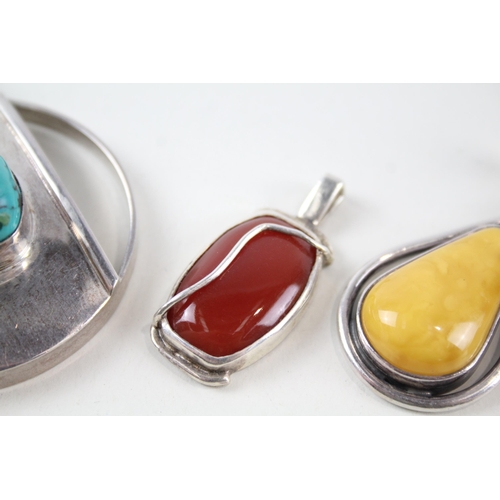 2148 - Four sterling silver gemstone pendants to include amber, turquoise etc. - approx. gross weight 67g