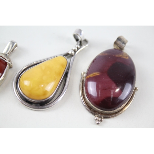 2148 - Four sterling silver gemstone pendants to include amber, turquoise etc. - approx. gross weight 67g