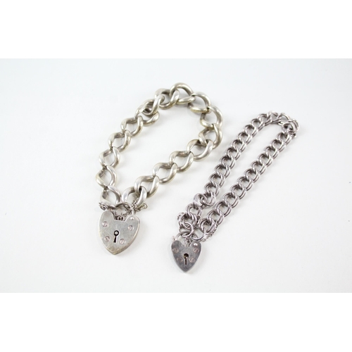 2150 - Two sterling silver bracelets with heart shaped padlock clasps - approx. gross weight 46g