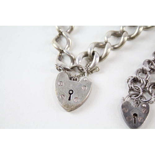 2150 - Two sterling silver bracelets with heart shaped padlock clasps - approx. gross weight 46g