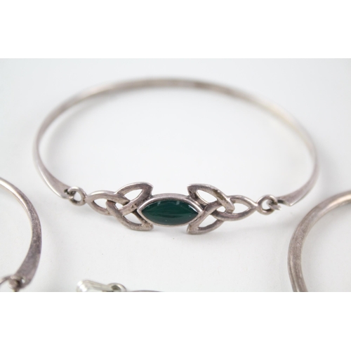 2162 - Four pieces of Scottish .925 silver jewellery, one Ola Gorie pendant and three bangles - approx. gro... 