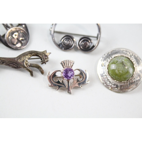 2165 - Five Scottish sterling silver brooches to include Kit Heath, amethyst etc. - approx. gross weight 21... 