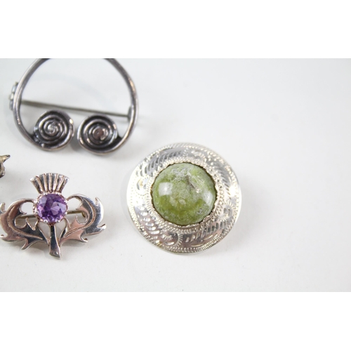 2165 - Five Scottish sterling silver brooches to include Kit Heath, amethyst etc. - approx. gross weight 21... 