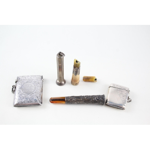 2305 - Five pieces of hallmarked sterling silver tobacciana to include two vesta cases, two cheroot holders... 