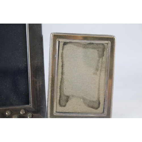 2309 - Three hallmarked sterling silver photo frames - largest approx. 18.5cm high x 14cm wide