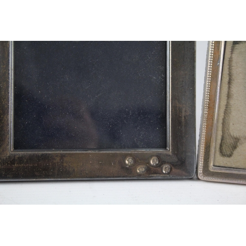 2309 - Three hallmarked sterling silver photo frames - largest approx. 18.5cm high x 14cm wide