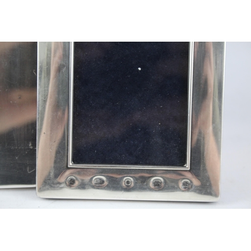 2312 - Three hallmarked sterling silver photo frames - largest approx. 20cm high x 15cm wide