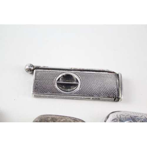 2313 - Four .925 sterling silver tobacciana accessories, three vesta cases and one cigar cutter - approx. g... 