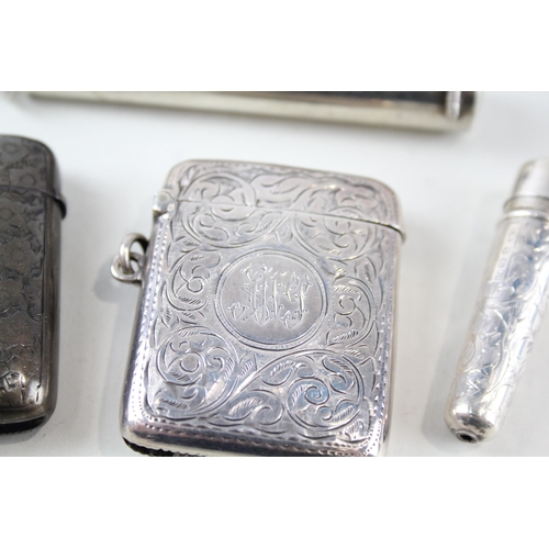 2320 - Four .925 sterling silver tobacciana accessories, two vesta cases and two cheroot cases - approx. gr... 