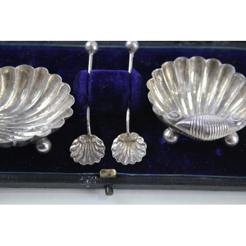 2323 - Six .925 sterling silver items, two decanter labels and a pair of cased shell shaped condiment dishe... 