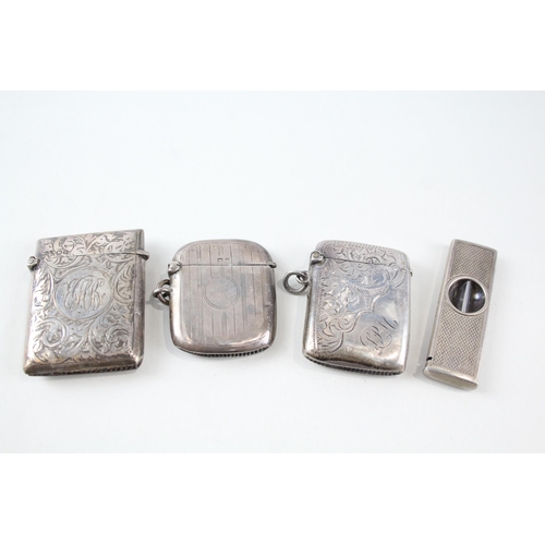 2330 - Four pieces of antique hallmarked silver, three vesta cases and one cigar cutter - approx. gross wei... 