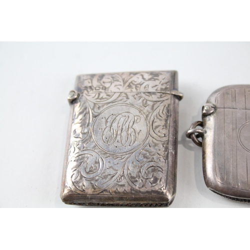 2330 - Four pieces of antique hallmarked silver, three vesta cases and one cigar cutter - approx. gross wei... 