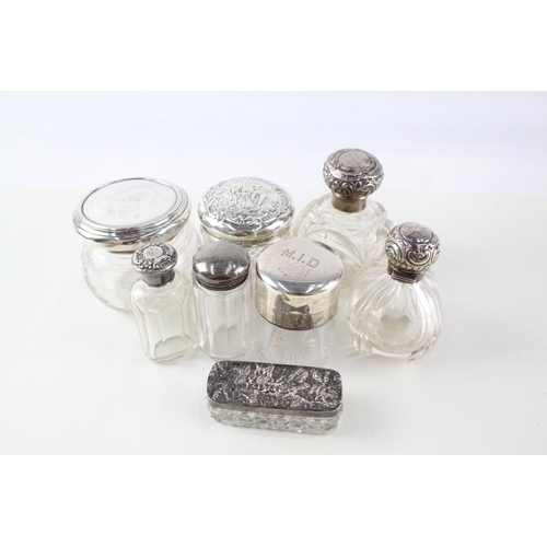 2331 - Eight .925 sterling silver and cut glass dressing table jars/bottles