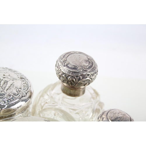 2331 - Eight .925 sterling silver and cut glass dressing table jars/bottles