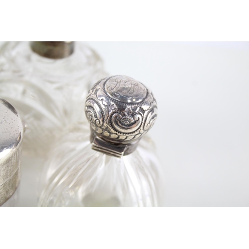 2331 - Eight .925 sterling silver and cut glass dressing table jars/bottles