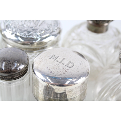 2331 - Eight .925 sterling silver and cut glass dressing table jars/bottles