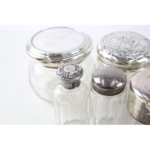 2331 - Eight .925 sterling silver and cut glass dressing table jars/bottles